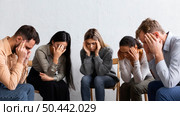 sad people group therapy session. Стоковое фото, агентство Ingram Publishing / Фотобанк Лори