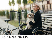 pretty woman petting her cute dog 2. Стоковое фото, агентство Ingram Publishing / Фотобанк Лори