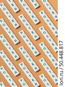 Poster words formed of scrabble tiles repeated over brown background.. Poster formed of scrabble tiles repeated over brown background. Стоковое фото, агентство Ingram Publishing / Фотобанк Лори