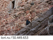 Looking up at the Old Stonework of a Medieval Castle in Europe. Стоковое фото, фотограф Aleksandr Golubev / Фотобанк Лори