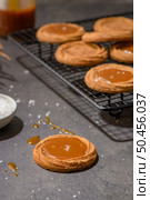 Caramel cookies flowing out of the oven, in the kitchen after baking. Стоковое фото, агентство Ingram Publishing / Фотобанк Лори
