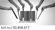 Consumer demand or flash rob as a group of robbers or customer buying frenzy and retail crime or buyer purchases symbol as diverse hands grabbing or taking the bars in a barcode or upc code in a 3D illustration style. Стоковое фото, агентство Ingram Publishing / Фотобанк Лори