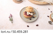 Scones with Strawberry Jam and Clotted Cream with milk served on glass bottle on white kitchen countertop. Стоковое фото, агентство Ingram Publishing / Фотобанк Лори