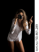 Fashion Portrait of young Woman photographer with camera. Стоковое фото, агентство Ingram Publishing / Фотобанк Лори