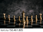 Gold Chess on chess board game for business metaphor leadership concept . Стоковое фото, агентство Ingram Publishing / Фотобанк Лори