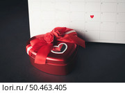 Red Heart in February 14 on the calendar with Heart shaped gift box, Valentine’s day concept. Стоковое фото, агентство Ingram Publishing / Фотобанк Лори