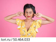 Fashion woman hand cover her ears. Стоковое фото, агентство Ingram Publishing / Фотобанк Лори