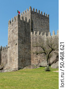 Medieval castle in Guimaraes city, Norte region of Portugal. Стоковое фото, агентство Ingram Publishing / Фотобанк Лори
