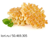Pile of sweet waffles with green mint leaves isolated on white background. Стоковое фото, агентство Ingram Publishing / Фотобанк Лори