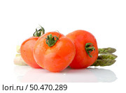 Composition of: tomato and asparagus Isolated on white background. Стоковое фото, агентство Ingram Publishing / Фотобанк Лори