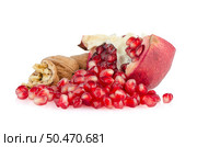Broken half pomegranate fruit on white background. Стоковое фото, агентство Ingram Publishing / Фотобанк Лори