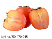 Ripe persimmons on white background. Стоковое фото, агентство Ingram Publishing / Фотобанк Лори