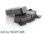 Car brake pads on white reflective background. Стоковое фото, агентство Ingram Publishing / Фотобанк Лори