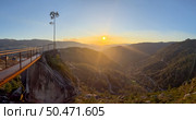 View from Fafiao viewpoint over a valley at sunset. River surrounded by hills in Peneda Geres National Park. Стоковое фото, агентство Ingram Publishing / Фотобанк Лори