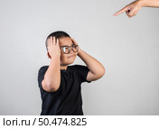Boy feels sad after the parents scold him. Стоковое фото, агентство Ingram Publishing / Фотобанк Лори