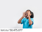 little girl acting Shout in studio shot. Стоковое фото, агентство Ingram Publishing / Фотобанк Лори