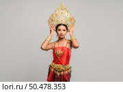 Women wearing Thai clothes and handles on the crown. Стоковое фото, агентство Ingram Publishing / Фотобанк Лори