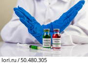 Scientists wear blue gloves and make hands unacceptable vaccine  Selective focus. Стоковое фото, агентство Ingram Publishing / Фотобанк Лори