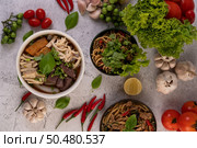 Large noodles with pork blood sausage, shredded chicken, crispy pork and sliced ??spring onions. Стоковое фото, агентство Ingram Publishing / Фотобанк Лори