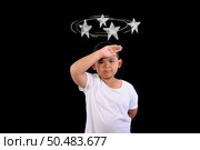 The boy is confused, not knowing where to go. Стоковое фото, агентство Ingram Publishing / Фотобанк Лори
