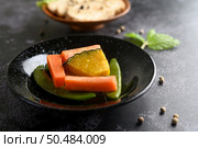 Peas, carrots and pumpkins on the plate. Selective focus. Стоковое фото, агентство Ingram Publishing / Фотобанк Лори