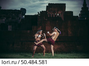 Two boxers fight with the martial arts of Muay Thai. Selective focus. Стоковое фото, агентство Ingram Publishing / Фотобанк Лори