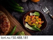 chicken Stir Fried Chili Along with bell pepper Tomatoes and carrots. Стоковое фото, агентство Ingram Publishing / Фотобанк Лори