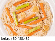 Stir-fried golden needle mushroom in a white plate with garlic. Carrots and asparagus. Стоковое фото, агентство Ingram Publishing / Фотобанк Лори