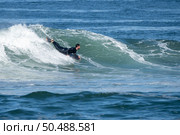 Bodyboarder surfing ocean wave on a sunny winter day. Стоковое фото, агентство Ingram Publishing / Фотобанк Лори
