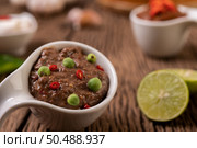 Nam phrik kapi  with Chili and Lemon on wooden floor. Стоковое фото, агентство Ingram Publishing / Фотобанк Лори
