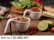 Nam phrik kapi  with Chili and Lemon on wooden floor. Стоковое фото, агентство Ingram Publishing / Фотобанк Лори