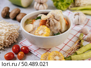 Chicken soup with corn, shiitake mushroom, enoki mushroom, and carrot. Стоковое фото, агентство Ingram Publishing / Фотобанк Лори