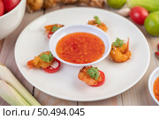 Shrimp deep-fried batter arranged beautifully in a white dish. Стоковое фото, агентство Ingram Publishing / Фотобанк Лори