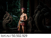 Portrait Handsome shirtless man in turban on head and beautiful silver ornament, The actor in Perform on legend love popular story, Thai Isan folktale called "Phadaeng and Nang-ai" in acient site. Стоковое фото, агентство Ingram Publishing / Фотобанк Лори