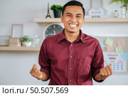 The male worker got the job done and pretended to be happy. Стоковое фото, агентство Ingram Publishing / Фотобанк Лори
