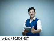 Portrait of Businessman rookie in the new entrepreneurial with a tablet as a tool to help in the work. Стоковое фото, агентство Ingram Publishing / Фотобанк Лори