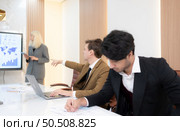 Group of young businessmen in international companies, Meeting to conclude a new responsible project. Стоковое фото, агентство Ingram Publishing / Фотобанк Лори