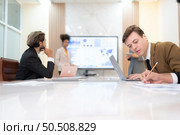 Group of young businessmen in international companies, Meeting to conclude a new responsible project. Стоковое фото, агентство Ingram Publishing / Фотобанк Лори