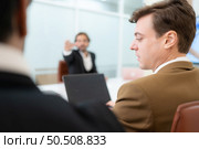 Group of young businessmen in international companies, Meeting to conclude a new responsible project. Стоковое фото, агентство Ingram Publishing / Фотобанк Лори