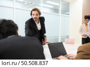 Group of young businessmen in international companies, Meeting to conclude a new responsible project. Стоковое фото, агентство Ingram Publishing / Фотобанк Лори