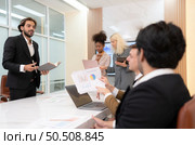 Group of young businessmen in international companies, Meeting to conclude a new responsible project. Стоковое фото, агентство Ingram Publishing / Фотобанк Лори