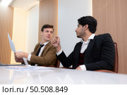 Group of young businessmen in international companies, Meeting to conclude a new responsible project. Стоковое фото, агентство Ingram Publishing / Фотобанк Лори