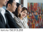 Young asian woman freshman joined the group of young entrepreneurs with three seniors on the team. Welcomed and introduced to senior management. Стоковое фото, агентство Ingram Publishing / Фотобанк Лори
