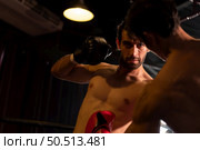 Punching is one of the master techniques of Muay Thai that is used to kick and lift to prevent kicks. which boxers are popularly used as weapons, Muay Thai,Thai martial arts. Стоковое фото, агентство Ingram Publishing / Фотобанк Лори