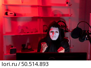 This is the face of a hacker who is knowledgeable with operating systems and other programs. He will exploit flaws and breach the computer system to cause damage. Стоковое фото, агентство Ingram Publishing / Фотобанк Лори