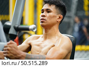 Mixed martial arts fighter going to the gym to build strong muscles To help make the collision more intense and help reduce injuries from punching as well. Стоковое фото, агентство Ingram Publishing / Фотобанк Лори