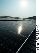 Solar farm on roof and sunset Solar modules for renewable energy technology that people have access to. Стоковое фото, агентство Ingram Publishing / Фотобанк Лори