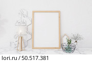Picture frames with plant pots adorn the living room. Стоковое фото, агентство Ingram Publishing / Фотобанк Лори