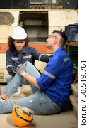 Working in a large industrial facility with heavy materials and machinery. Safety considerations are therefore of the utmost significance. Extreme vigilance must be exercised in this situation. Стоковое фото, агентство Ingram Publishing / Фотобанк Лори