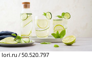 Water flavored with lemon, cucumber and lemongrass leaves. Стоковое фото, агентство Ingram Publishing / Фотобанк Лори